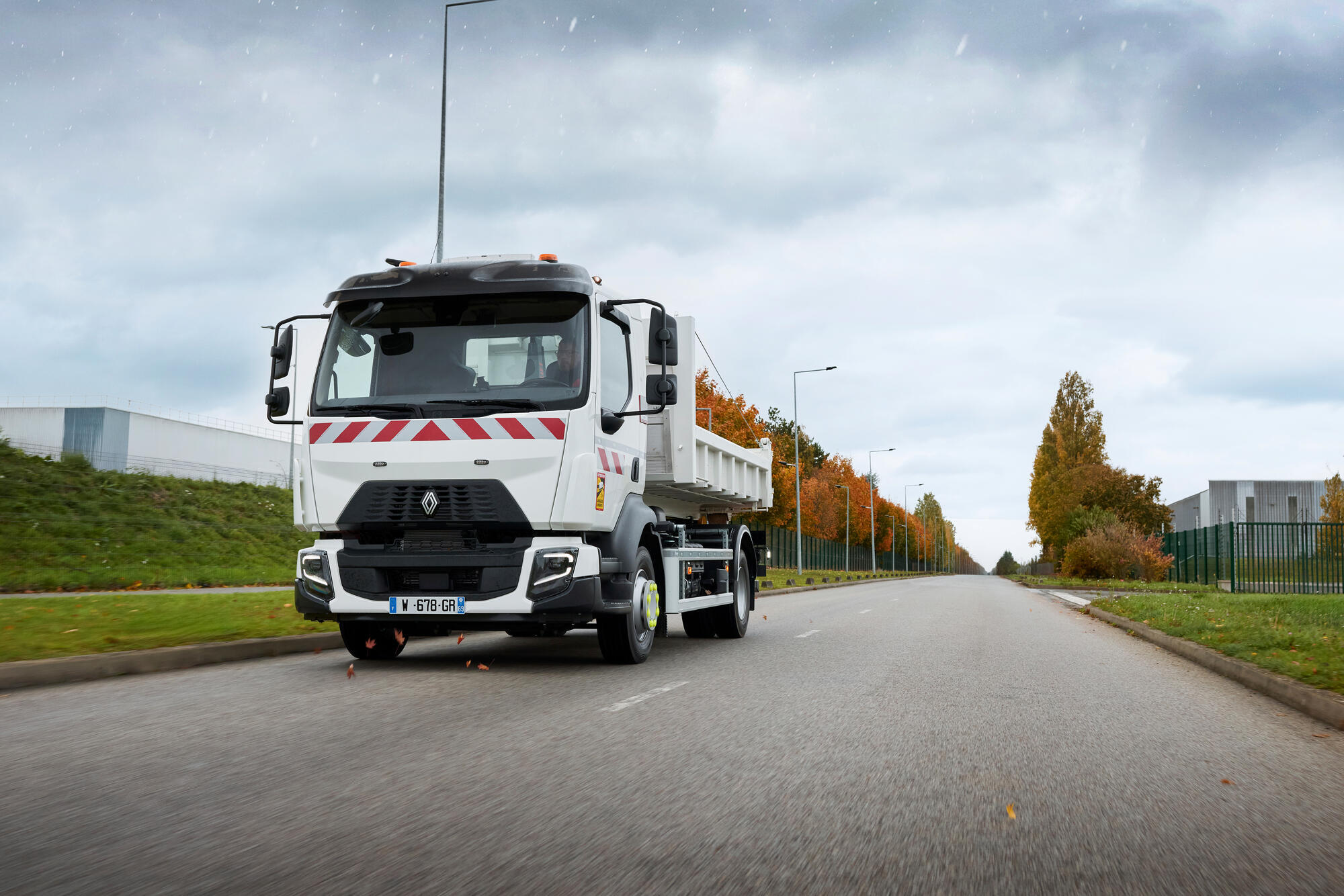 Renault Trucks D 12-tonne / 14-tonne fitted with a Hiab crane on the road