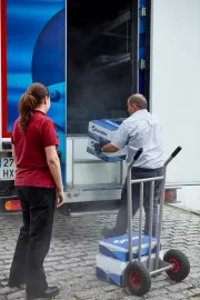 A driver unloading a refrigerated truck